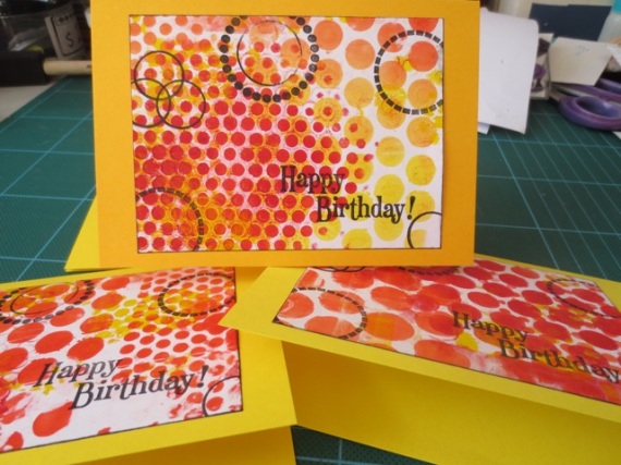 using red tones gelli plate prints for handmade greeting cards